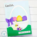 Easter card with a basket of eggs and a chick on a light blue background