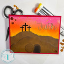 Card with three crosses and the word 'Faith' on a sunset background, surrounded by crafting tools.
