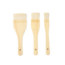 Three wooden paint brushes in different sizes arranged vertically on a plain white background.