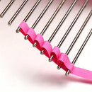 Metal rods with pink ribbons attached on a light pink background