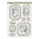A sheet of decorative Christmas card designs with layered scalloped frames, winter illustrations including a snowman and a hedgehog in a snowy landscape, and festive phrases such as 'Winter Garden Colors,' 'Merry,' 'Special,' and 'Christmas Wish.'.
