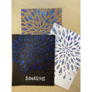 Three greeting cards with blue feather patterns on a beige surface