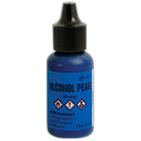 Blue bottle of alcohol ink with black cap on a white background