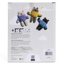 Back of a product packaging with three knitted bear toys and care instructions.