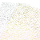 Two sheets of patterned paper or vinyl with a repeating script-like design, one in metallic gold and one in metallic silver, displayed diagonally on a white background.