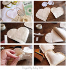 A six-panel collage showing the step-by-step process of making a fabric heart ornament. The steps include cutting out a heart shape, peeling off a backing paper layer, folding the fabric, and assembling the heart.
