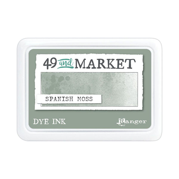 A square white plastic ink pad package labeled '49 and MARKET' and 'SPANISH MOSS' dye ink, with a muted sage green color sample shown on the front.