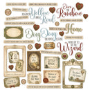 A sheet of vintage-style scrapbook paper or craft embellishments featuring retro text phrases, decorative frames, hearts, and small labels in muted beige, brown, and dusty red tones. Visible text includes phrases like 'Yellow Road,' 'Over the Rainbow,' 'Ding Dong the Witch is Gone,' 'Little Magic,' and 'No place like home,' with 'OZ' and 'Lumiere City Waterworks Co.