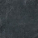 Dark charcoal textured surface with subtle mottled gray and black tones.