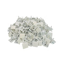 A pile of small white plastic hardware clips or fasteners on a plain white background.