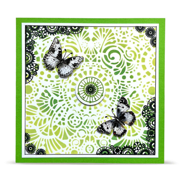 A square handmade greeting card featuring a vibrant green border and a white and lime green mandala pattern with two black and white butterfly embellishments.
