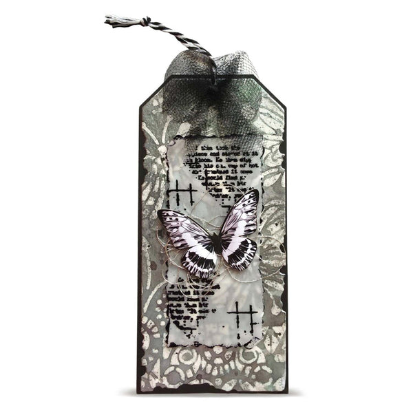 A decorative gift tag with a black wired border, featuring a layered design of vintage script, floral patterns, a butterfly embellishment, and a black mesh bow at the top on a white background.