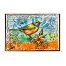 A framed mixed-media art print featuring a colorful bird perched on a flower, set against a background of vintage postcard designs, handwritten notes, and watercolor washes in orange, blue, green, and yellow.