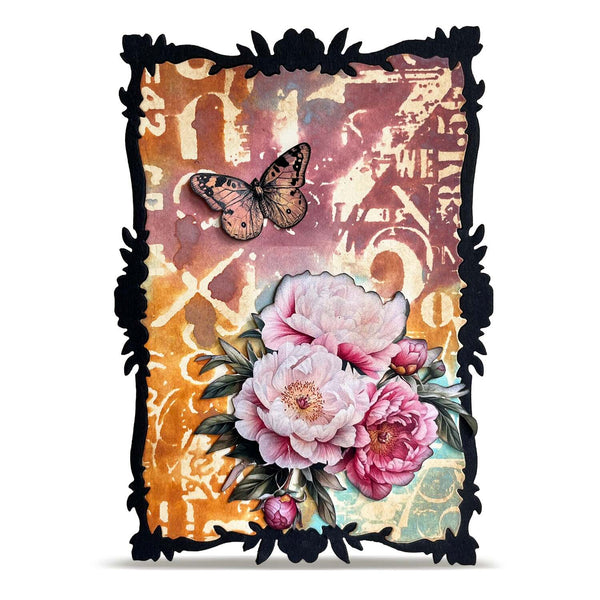 A decorative art print or card featuring a black ornate frame, pink peony flowers, a butterfly, and a warm multicolor abstract background on a white studio backdrop.
