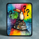 A square framed art print featuring a painted toucan perched on a stack of books against a vivid rainbow watercolor background with black question marks and handwritten text details, displayed against a textured gray backdrop.