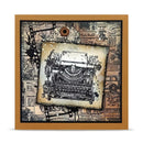 A square framed art piece featuring a vintage typewriter illustration layered over distressed newspaper clippings and ink-splatter graphics, with a tan wood frame and a small hanging loop at the top.