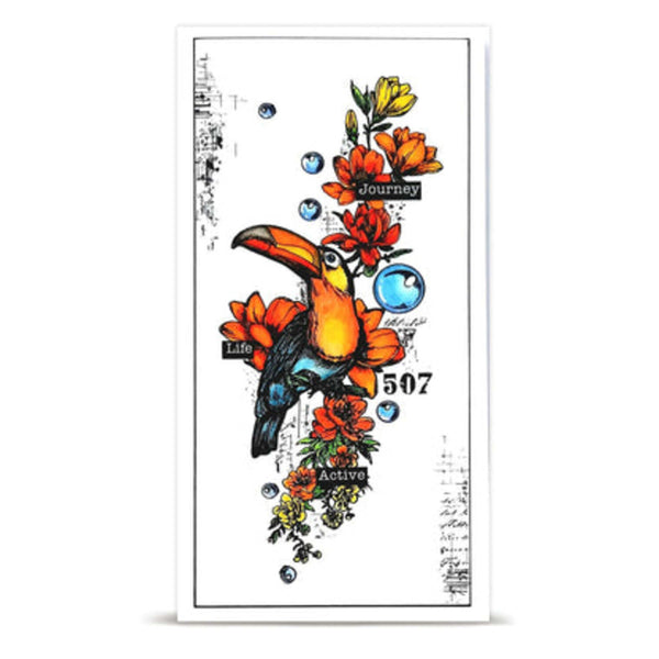 A vertical rectangular art print or card featuring a colorful toucan perched among orange flowers, blue bubbles, handwritten script, and small text labels including 'journey', 'Life', and '507'. The print is centered on a light gray background with a soft shadow beneath it.