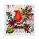 A square art print or card featuring a robin bird perched on a branch with autumn leaves, set against a textured watercolor-style background with a white border.