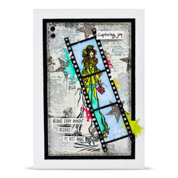 Framed artwork with a stylized illustration of a person in a yellow jacket and blue pants, surrounded by filmstrip elements and text.