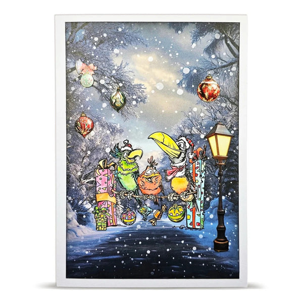 A framed art print featuring a whimsical winter scene with cartoon animals gathered by a glowing street lamp, wrapped in colorful holiday ribbons, under a snowy sky with ornaments and falling snow.