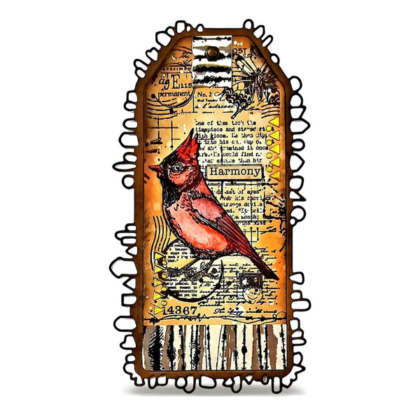 A decorative mixed-media art piece featuring a red cardinal bird on a vintage-style collage background with handwritten text, stamps, and musical notes, framed by a black ornate border on a white background.