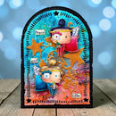 A decorative arched plaque or art piece featuring two cartoon cherubs with wings, gold stars, and the words 'Peace and light' on a colorful blue, orange, and pink background, displayed on a wooden surface with a blurred blue bokeh backdrop.