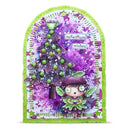 A handmade paper card with a whimsical fairy and Christmas tree design, featuring a bright lime green border, purple and white watercolor splatter background, and green accents.