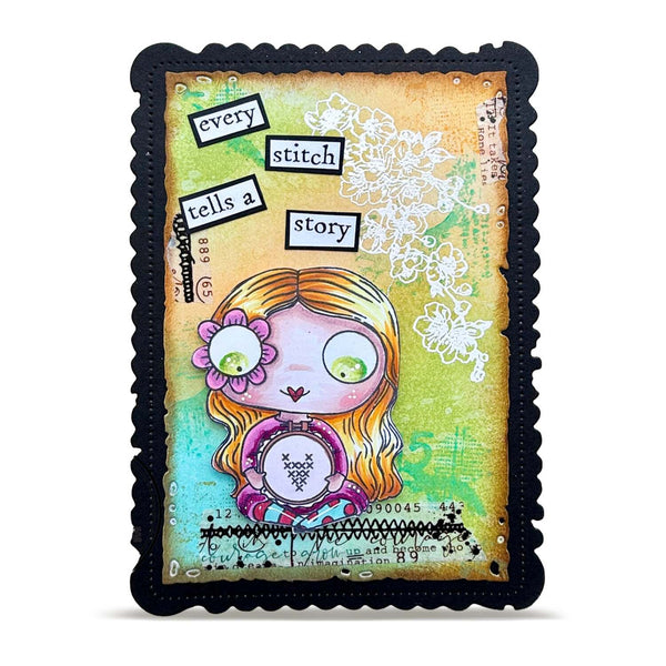 A square mixed-media art card featuring a whimsical cartoon girl with large eyes, orange hair, and a pink flower, surrounded by text boxes and decorative elements, framed by a black scalloped border on a white background.