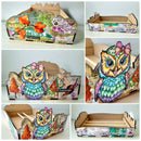 A collage of six views showing a decorative cardboard storage box with a colorful owl illustration and scrapbook-style printed details. The box is shown from multiple angles, including open and closed views, on a plain light background.