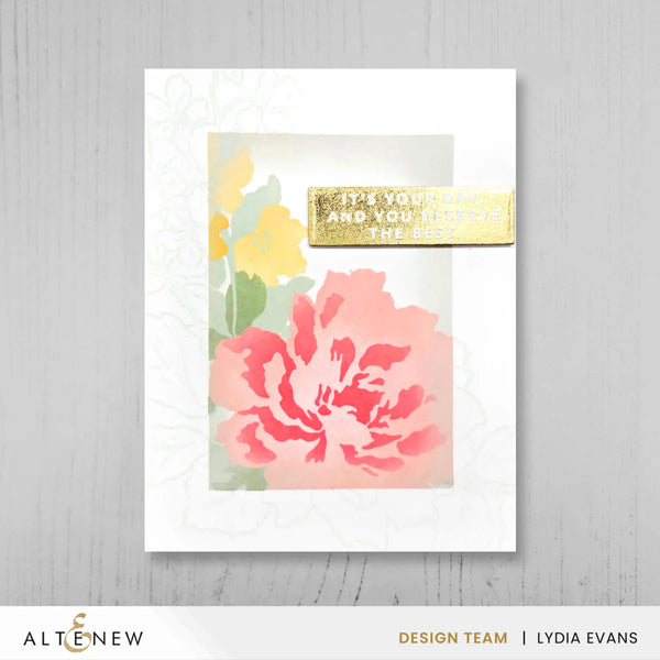 Floral card with pink and yellow flowers and a gold message on a white background