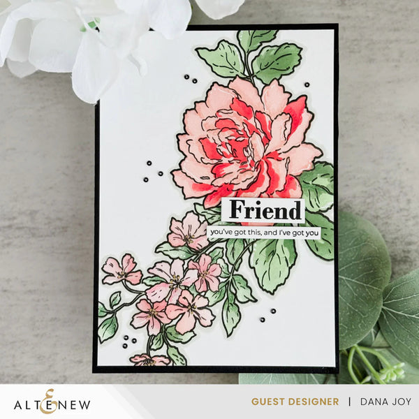 Card with floral design and 'Friend' message on a light background
