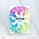 Card with colorful leaf pattern and text 'big hugs you are loved' on a white background