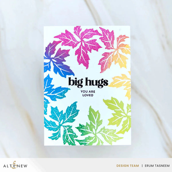 Card with colorful leaf pattern and text 'big hugs you are loved' on a white background