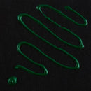 Green liquid smears on a black background