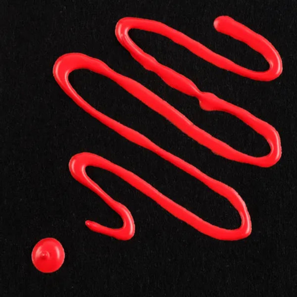 Red drizzle and droplet on a black background