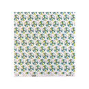 A square sheet of patterned paper with a repeating geometric starburst design in teal, lime green, and gray on a white background, shown flat against a light gray backdrop.