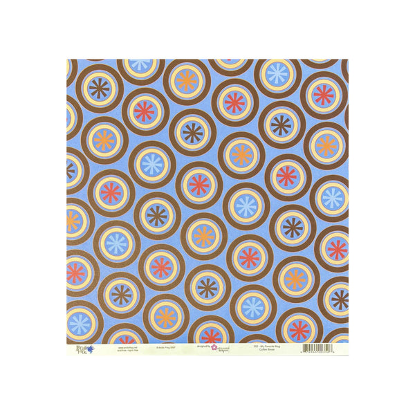 A square sheet of patterned paper with a repeating geometric design of brown, gold, blue, red, and orange circular medallions on a light blue background, photographed flat against a white backdrop.
