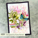 A rectangular art print or card featuring a botanical collage with pink flowers, green leaves, purple blossoms, and a blue butterfly over a vintage script background. The print is photographed on a textured gray surface, with the brand name ARDEN and designer credit 'Designed by Katie Pertiet' visible at the bottom.