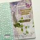 Decorative notebook with floral patterns and text on a white background