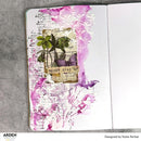 Decorative notebook page with floral design and motivational quote on a gray surface