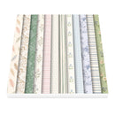 A stack of patterned paper sheets fanned out, showing multiple pastel designs including floral, gingham, stripes, and polka dots in soft green, blue, pink, beige, and white.