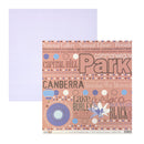 A sheet of patterned scrapbook paper shown with a second plain matching paper behind it. The front sheet has a dusty pink background with multicolored text words like 'Park,' 'Canberra,' 'Lake Gungahlin,' and decorative dots and circular motifs.