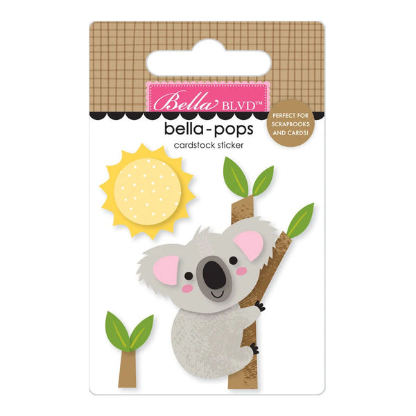 Bella BLVD Bella Pops cardstock sticker featuring a cute koala on a tree branch, a yellow sun, and small green leaves, displayed on its original retail backing card.