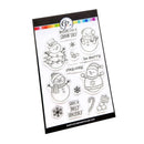 A sheet of clear stamp designs featuring snowman illustrations and holiday phrases like 'be merry stay cozy' and 'HAVE A JOLLY HOLIDAY' on a white backing card with a black border.