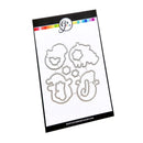 A packaged metal die-cut craft set on a white card with a black border. The set includes four whimsical character-shaped cutouts and small star and hexagon shapes.