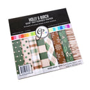 Holly & Birch Patterned Paper pack by Paper Hearts, featuring 24 sheets of 6x6" patterned cardstock in 8 unique designs. The packaging displays a black header with white text and a colorful stripe, with several patterned sheets visible inside, including green polka dots, beige plaid, green plaid, brown snowflakes, and striped designs.