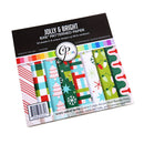A package of CP Papers 'Jolly & Bright' 6x6 patterned paper, featuring 24 sheets of holiday-themed patterned cardstock with designs like Christmas trees, stockings, candy canes, and snowflakes.