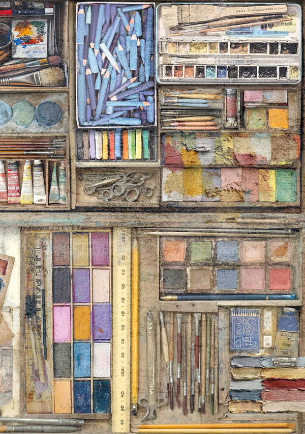 Collection of art supplies including paint tubes, brushes, and palettes.