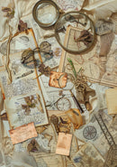 Vintage items including glasses, a compass, and a magnifying glass on top of old maps and papers.