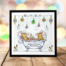 A square framed Christmas greeting card or print displayed on a wooden surface with colorful blurred holiday lights in the background. The artwork shows two mice sitting in a bathtub with ornaments, candles, and the text 'Bauble Bath' and 'Speaking in to wish you a Merry Christmas'.